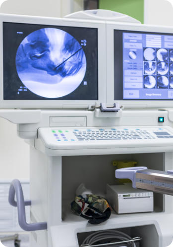 An arthroscopy machine displays images of a knee during a medical procedure